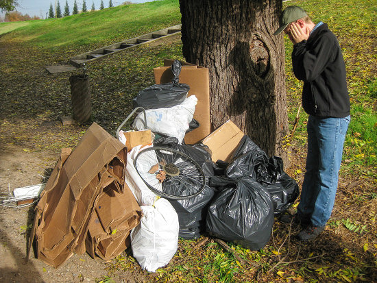 Erik Jensen hamming it up over much, but not all, of the results of our work. Other trash was left at collection barrels elsewhere on the trail.