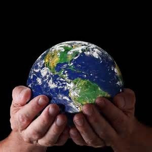 image of hands holding Earth