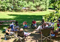 People sitting outdoors in a circle