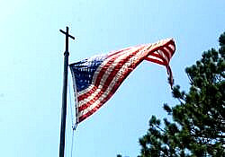 American flag with a cross photo by Cody Otto unsplash.com